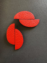 Load image into Gallery viewer, Handcrafted sculptural red leather earrings with overlapping organic geometric shapes on stainless steel posts.