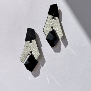 Black and white geometric drop earrings made from layered upcycled leather with faceted black Swarovski crystal bead