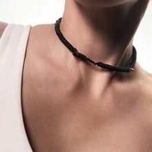 Load image into Gallery viewer, Handcrafted necklace featuring black leather discs, glossy obsidian stones, and translucent smoky quartz gemstones, designed with a bold and modern aesthetic.