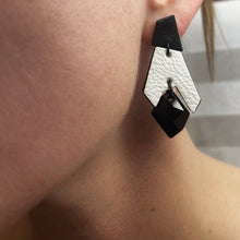 Load image into Gallery viewer, Black and white geometric drop earrings made from layered upcycled leather with faceted black Swarovski crystal beadBlack and white geometric drop earrings made from layered upcycled leather with faceted black Swarovski crystal bead