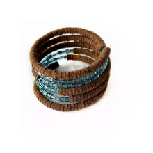 Load image into Gallery viewer, Wrap-around bracelet featuring earthy suede leather and shimmering Japanese beads in a layered design, showcasing a blend of texture and elegance. Lightweight and adjustable for a comfortable fit.