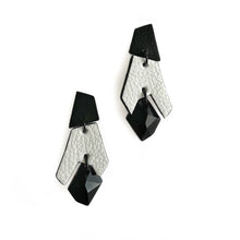 Load image into Gallery viewer, Black and white geometric drop earrings made from layered upcycled leather with faceted black Swarovski crystal bead