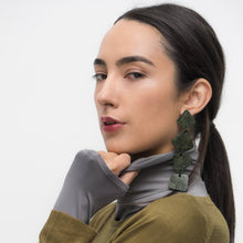 Load image into Gallery viewer, Bold geometric statement earrings handcrafted from upcycled dark green leather with a textured finish. Lightweight and stylish, perfect for making a sustainable and unique fashion statement.