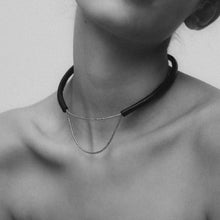 Load image into Gallery viewer, Close-up of a handcrafted leather choker featuring smooth black leather and delicate silver Japanese glass beads, creating a bold yet elegant minimalist design