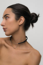 Load image into Gallery viewer, Close-up of a handcrafted leather choker featuring smooth black leather and delicate silver Japanese glass beads, creating a bold yet elegant minimalist design