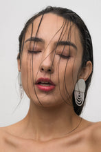 Load image into Gallery viewer, Off-white leather earrings with cascading translucent bead layers, featuring a textured finish and lightweight, modern design.