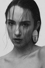 Load image into Gallery viewer, Off-white leather earrings with cascading translucent bead layers, featuring a textured finish and lightweight, modern design.