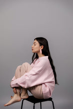 Load image into Gallery viewer, Layered pink leather earrings with rounded geometric shapes on model