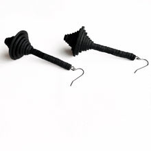 Load image into Gallery viewer, Close-up of Axis dangle earrings made with upcycled leather in modern sculptural design.
