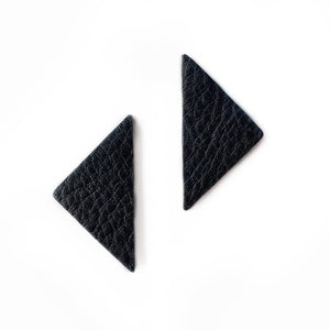 Our leather triangle earrings represent balance and power. The opulent leather adds a bold touch to your outfit. Wear them for a magical boost. Shop now and embrace sharp angles.
