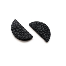 Load image into Gallery viewer, Upgrade your basic stud game with our leather studs that speak louder than words. These earrings add a touch of personality to any monochrome outfit and tie your look together phenomenally. The semicircle&#39;s bold yet simple shape, combined with the softest texture, exudes modern sophistication. The two pieces together represent wholeness, just like you. Don&#39;t miss out on these statement earrings that showcase your uniqueness. Shop now for a pair of earrings that complete your look