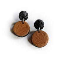 Load image into Gallery viewer, Effortlessly chic minimalist earrings in earthy tones. Basic shapes &amp; delicate leather grain add subtle character. Suspended circles symbolize wholeness &amp; promote a state of calm. Perfect for modernizing any outfit.