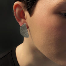Load image into Gallery viewer, Upgrade your basic stud game with our leather studs that speak louder than words. These earrings add a touch of personality to any monochrome outfit and tie your look together phenomenally. The semicircle&#39;s bold yet simple shape, combined with the softest texture, exudes modern sophistication. The two pieces together represent wholeness, just like you. Don&#39;t miss out on these statement earrings that showcase your uniqueness. Shop now for a pair of earrings that complete your look