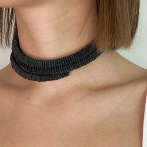 Discover the perfect blend of bold simplicity and high texture with WAIWAI's softest choker. The intriguing design of this helical choker symbolizes growth, evolution, and resilience. It flexes easily for comfortable wear, and its clasp-free design ensures clean lines from every angle. Experience the serpentine embrace of this choker's softness against your skin and forget it's even there. Elevate your jewelry collection with WAIWAI's unique and comfortable choker.