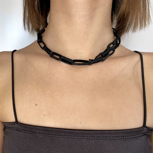 Elevate your jewelry collection with this unique hand-stitched leather chain from WAIWAI. The innovative design features leather links of different lengths and strategically-placed clasps, allowing for multiple styling options. The soft texture and visible grain of the high-quality leather make for a luxurious and comfortable wear. Lightweight and versatile, this chain adds a powerful sense of connectedness to any outfit.