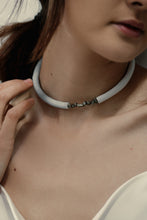 Load image into Gallery viewer, Our hand-stitched white leather choker with pyrite crystals embodies empowerment anchored by serenity. Pyrite deflects negative energy and promotes physical healing and mental strength. Complement any outfit with this choker that is soft, comfortable, and easy to wear. Shop now and feel empowered both inside and out.