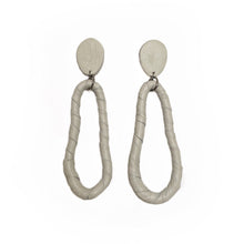 Load image into Gallery viewer, Discover the ultimate in versatility and style with our modern leather hoop earrings. Reshape them into circles or ovoids to reflect your mood of the moment, and enjoy their relaxed, carefree movement. Made from genuine leather and hypoallergenic stainless steel, these earrings are soft, lightweight, and add sophistication to any outfit. Express your personality with their distinct texture and shop now to experience the perfect combination of comfort and style.