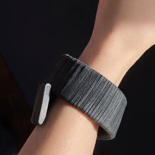 Load image into Gallery viewer, Simplicity meets meticulous craftsmanship in this universally flattering, award-winning leather cuff. Its intriguing curvature evokes movements found in nature and exudes power. Lightweight and comfortable, this durable cuff yields to your reshaping and is a wardrobe investment.