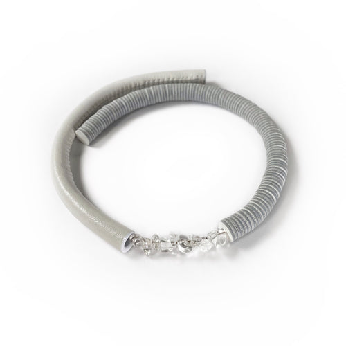Our hand-stitched white leather choker with clear quartz crystals exudes both tranquility and edge. Adorn any outfit for a refined appearance or to give intention to your look. WAIWAI chokers are the softest, lightest, and most comfortable you'll ever wear. Shop now and elevate your look with comfort and style.