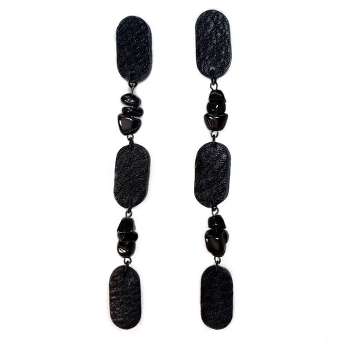 Add a touch of mystery to your style with these Hematite Gemstone Earrings. Their crisp elegance is accentuated by the raw metallic lustre, creating a clean modern style that's perfect for any occasion. Hematite adds a deeper connection to the earth, providing strength, stability, and protection. The earrings' carefree swing and your restored equilibrium will make you feel radiant, empowered, and serene like a modern goddess. Made with genuine leather, hypoallergenic stainless steel posts, and hematite