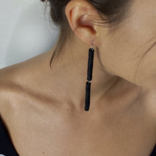Load image into Gallery viewer, Elevate your style with these unique and elegant Double Bar Dangle Earrings. With a minimalist design featuring two sleek leather bars, they are perfect for any occasion. Made with high-quality materials, they are comfortable to wear all day long. 
